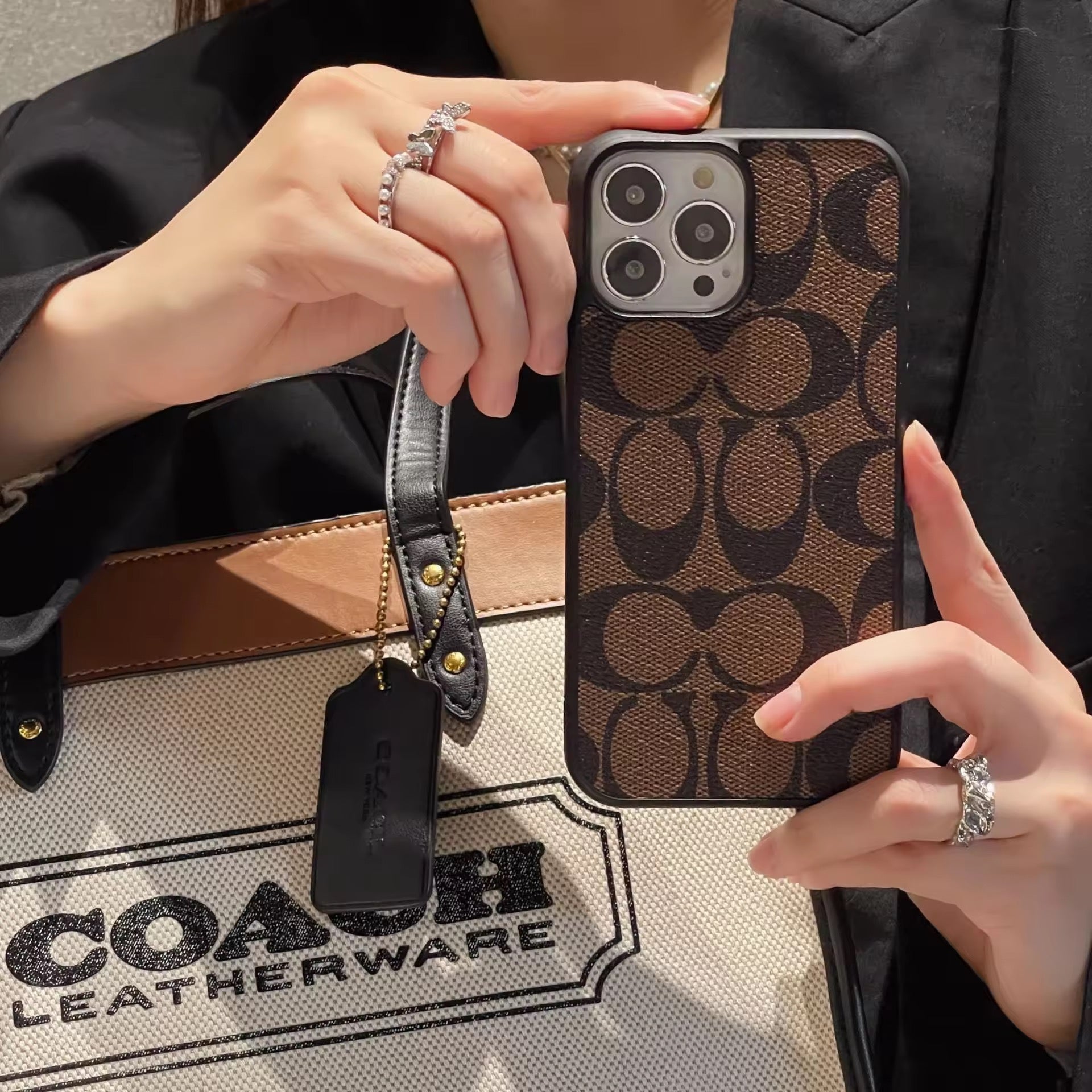 COACH brown iPhone Case